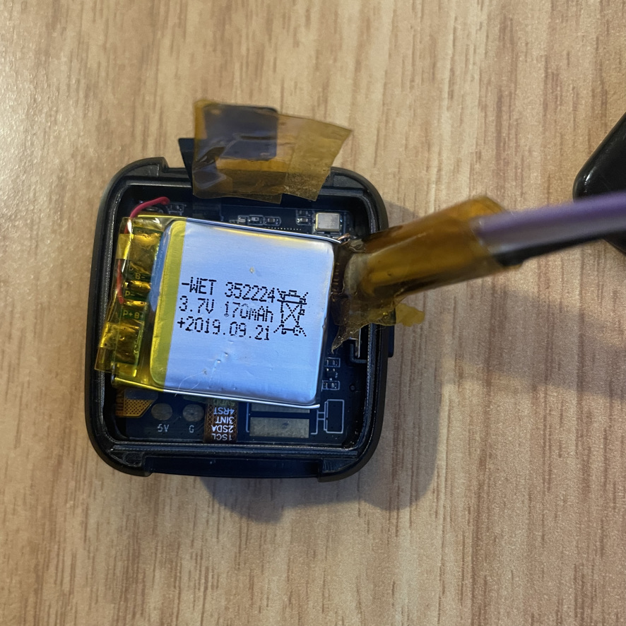The pin end of the adapter cable is inserted into the test points. Friction is usually enough to hold it in place. 